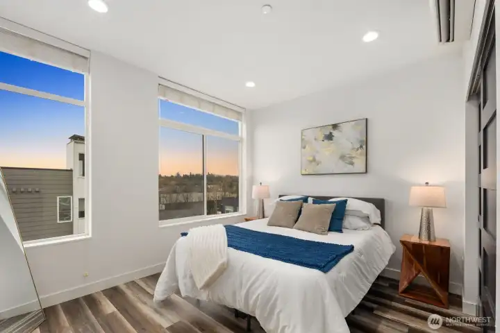 Primary shares the delightful Eastern exposure of the living room below.