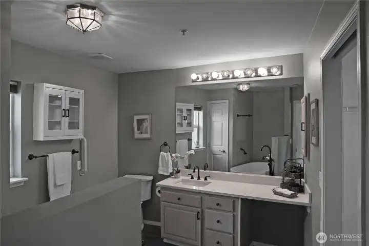 Renovated Primary Bathroom with quartz countertops and stand alone tub!