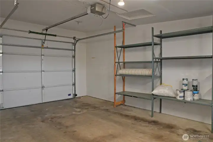 Spacious one car garage with a bench and storgage. Spacious one car garage with a bench and storgage.