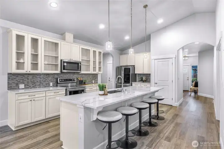 Entry leads to kitchen, den and great room