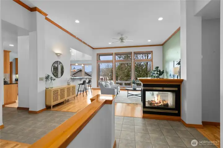Entry and living area with high ceilings and natural light