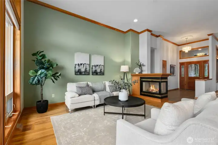 Entry, living, and dining spaces blend together for easy entertaining.