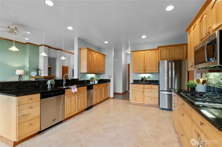 Kitchen and dining area with open flow to living spaces