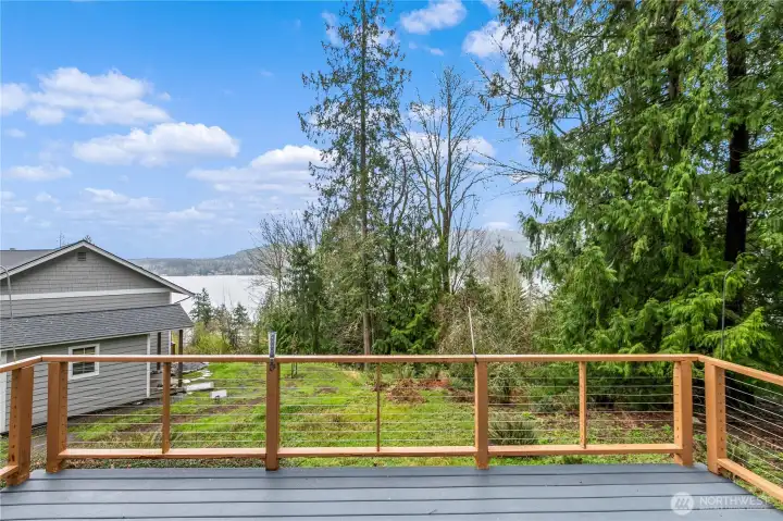 Deck with railing overlooking views of Lake Whatcom