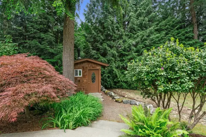Versatile shed complete with storage space, woodstove, and bunk beds