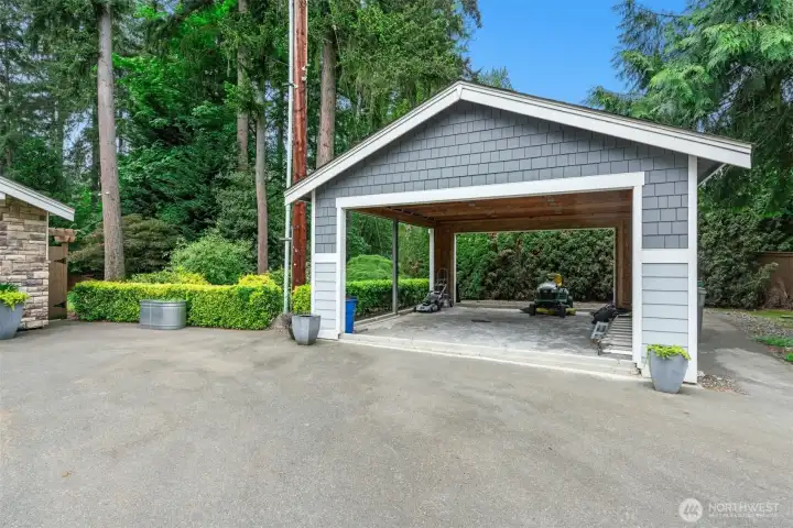 Additional workshop/garage space — previously a carport that has been partially converted with potential for a detached ADU — offers exciting possibilities for a guest space, studio, home office, or endless hobbies