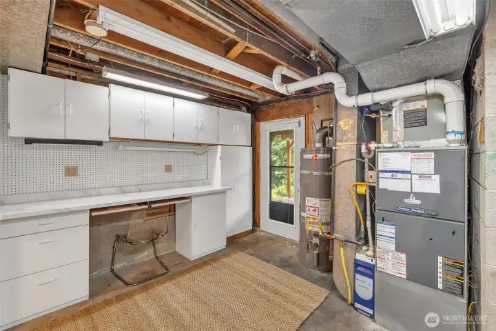 Utility room / shop space. New water heater. Recently serviced furnace (lower floor).
