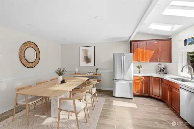 Kitchen and dining area - lower level (virtually staged)