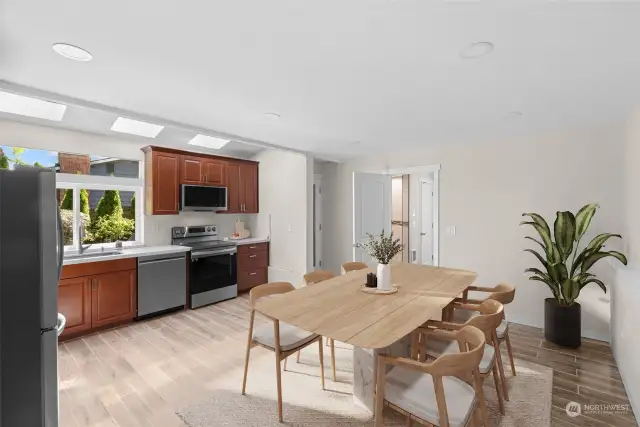 Kitchen and dining area - lower level (virtually staged)