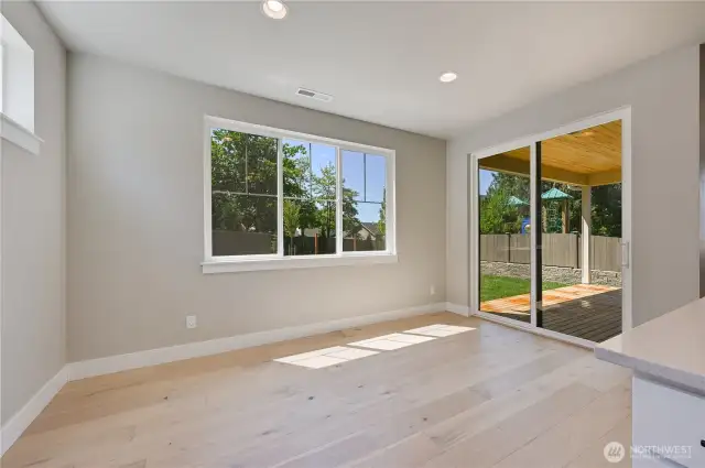 Abundant Natural Light from large slider leading to covered deck