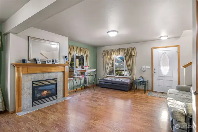 An inviting view of the living room, looking towards the welcoming entryway.