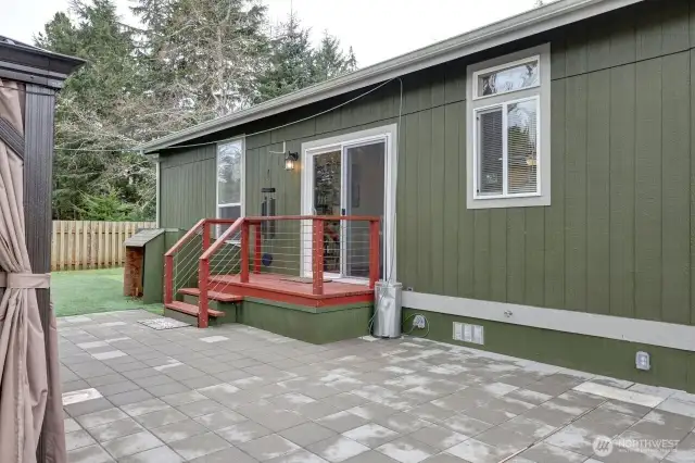 Great fully fenced low maintenance yard with patio pavers, gazebo, firepit, barbeque area.