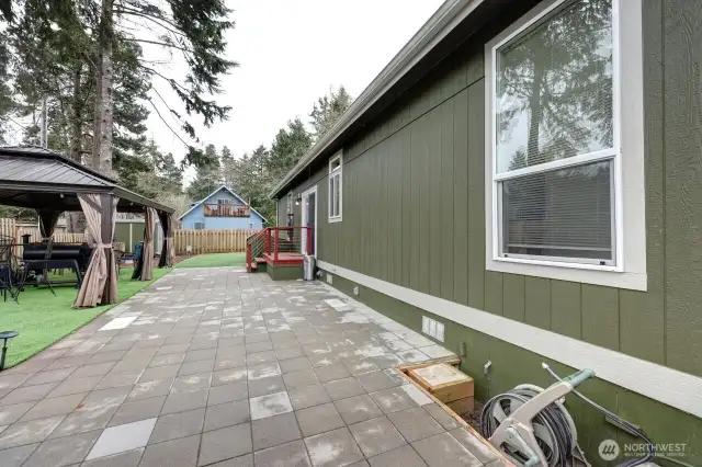 Great fully fenced low maintenance yard with patio pavers, gazebo, firepit, barbeque area.