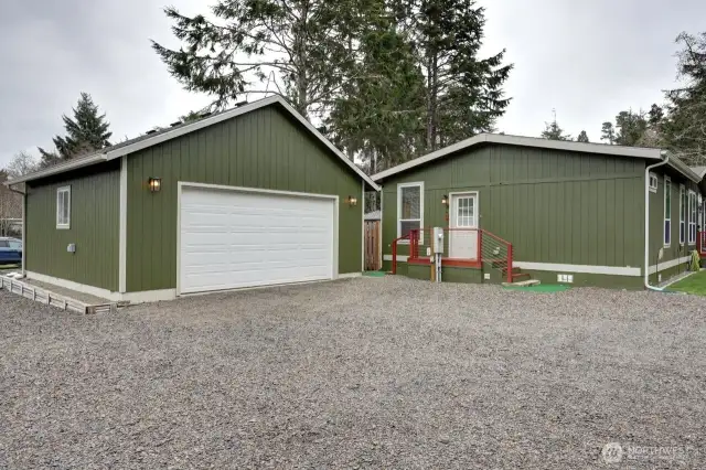 Oversize 2 car garage with plenty of overhead storage. There is a 2nd RV connection plug on the garage.