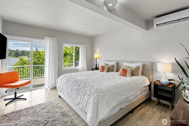 The primary bedroom is a private haven located on the main floor for easy access. Wake to serene lake views, step onto the deck from your own entrance, and enjoy the oversized walk-in closet—perfect as-is or ready to be reimagined as a sitting room or second kitchen for multi-generational living.