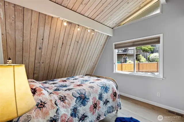 Every room tells a story. This bedroom is rich with character and warmth, offering a quiet retreat after lakeside adventures.