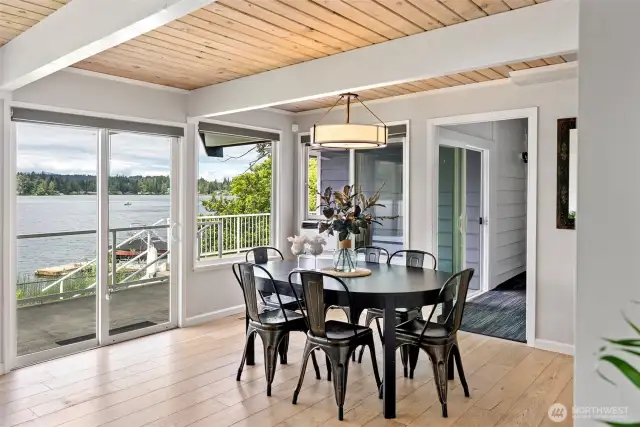 Gather around the table with lake views as your backdrop and natural light streaming in from every angle. Whether it’s a casual breakfast or a sunset dinner, this space invites connection and calm in every season.