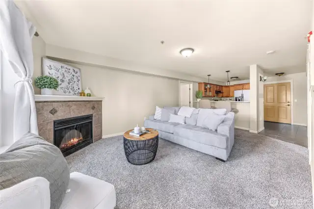 Cozy fireplace provides a great focal point to the room.