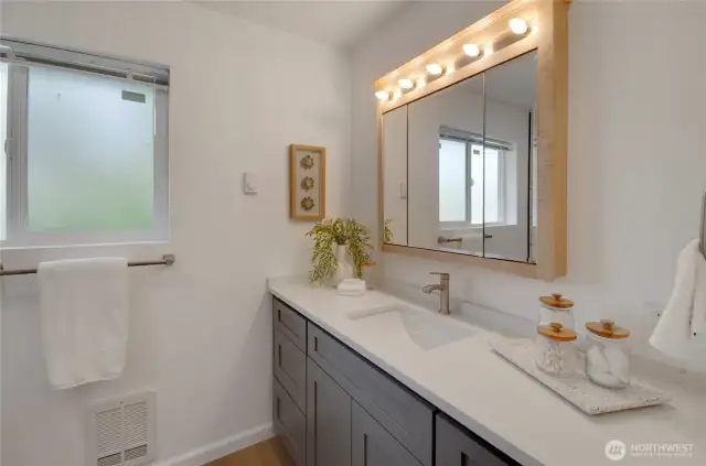 The upstairs bathroom is spacious and simply elegant.
