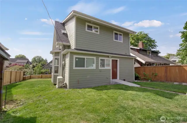 Look at the spacious yard! Perfect for summertime BBQs and ample parking via alleyway.