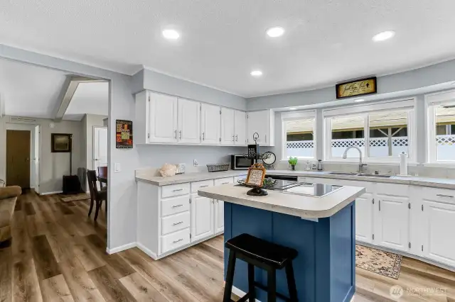 Kitchen features New Countertops, New Hardware, with Island & Cooktop!