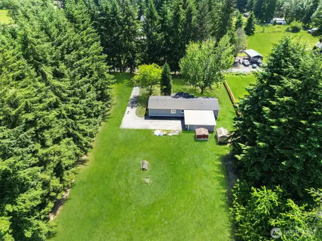 Enjoy this beautiful setting!!! Nearly whole Perimeter is enveloped in trees!