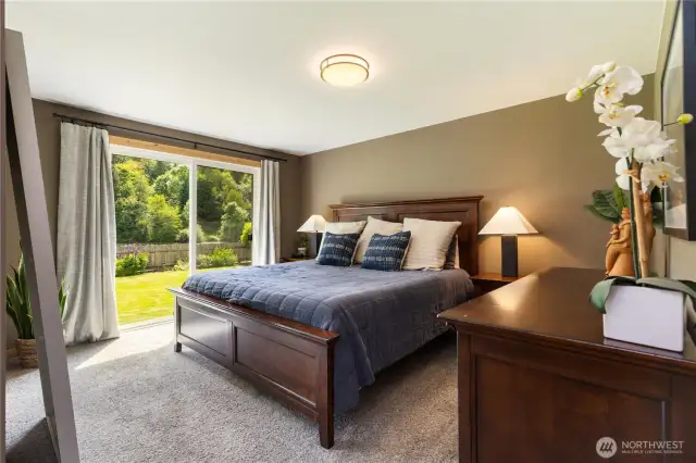 Primary bedroom with sliders out to the deck