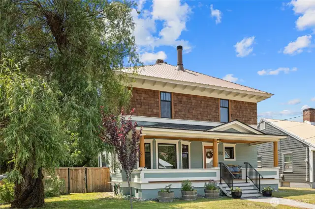 When layers of old siding was removed it exposed the original wood siding underneath that had been covered for years. Cedar shingles were added above to match photos of the home from the early 1900s.