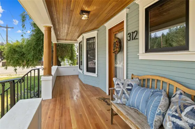 New Douglas Fir flooring on the porch and restored bead board in the soffits.