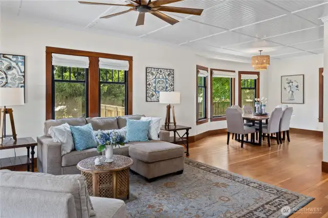 Original hardwood floors and millwork keep it classic, 60" Possini Defender Ceiling fan adds a modern touch.