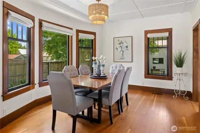 The dining area exudes timeless elegance, perfectly complementing the home’s period details.
