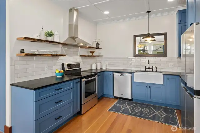 The kitchen features all-new cabinetry, sleek countertops, and stainless steel appliances—offering a fresh, modern look with everyday functionality.