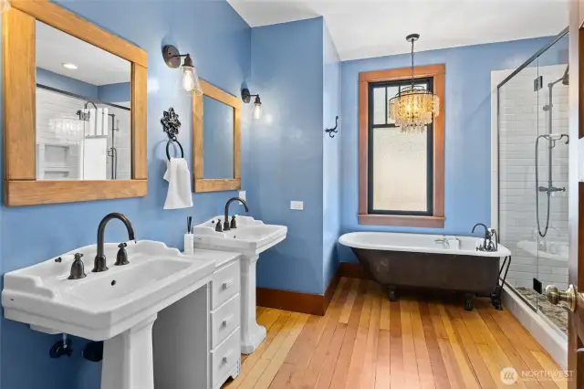 The upstairs bathroom is simply stunning, anchored by an original-style clawfoot tub that adds classic beauty and old-world charm.”