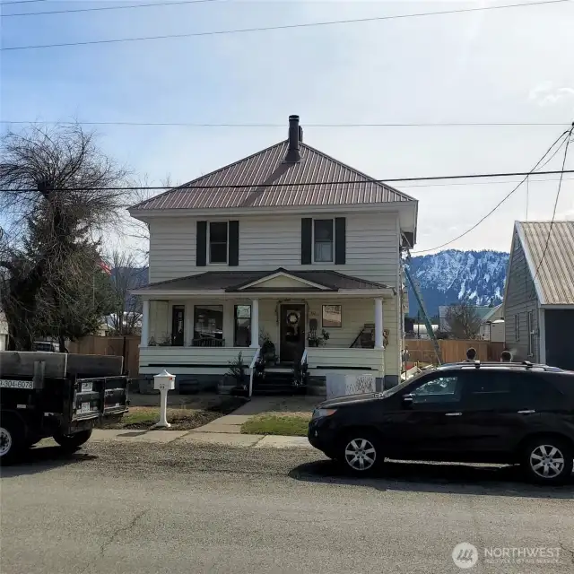 This is a photo of the home at the beginning of the process. Note the vinyl siding.