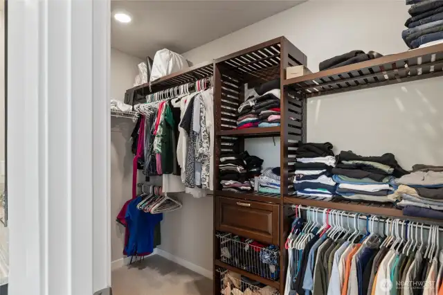 Walk in closet located off of primary bathroom