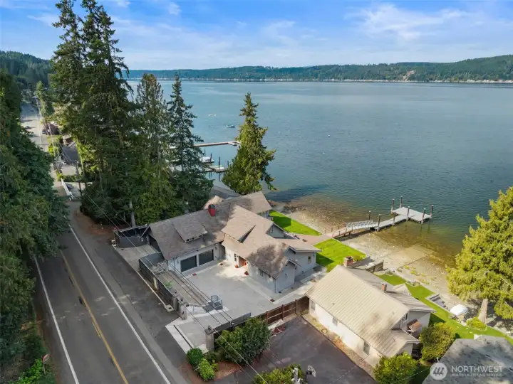 Gated entry with a street level garage and main level garage offers tons of parking and easy access