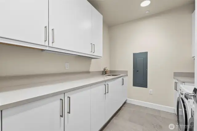 Storage galore in the utility room. Washer and dryer included!