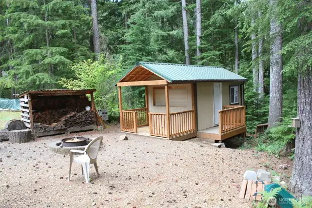 Side view of new shed and firepit area