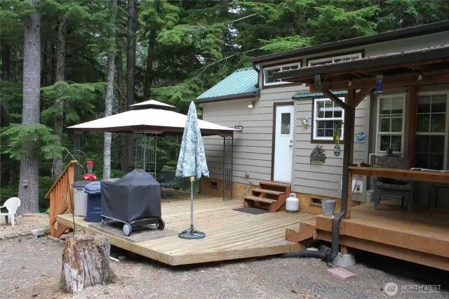 Lower deck with open area for sun and a gazebo area to keep cool