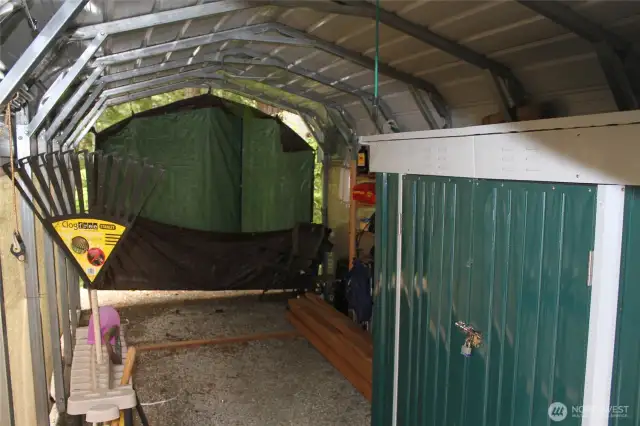 Interior of the carport showing metal storage