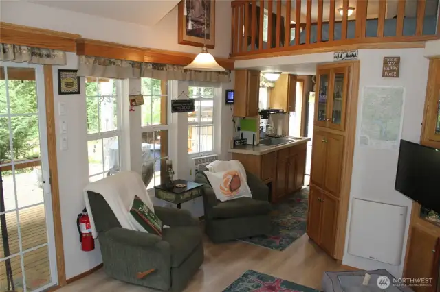More living room but facing the quaint kitchen. All appliances stay.