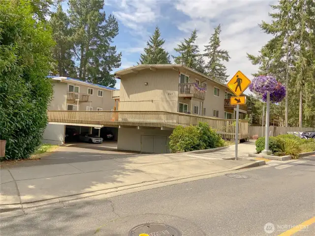 Heading west from highway 305, The Tillicum entrance to ground floor parking.  Unit 210 is on the second floor above, on the south side, just out of sight in this picture.