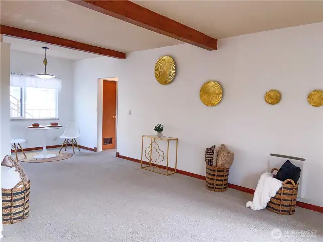 There's room to spare as you head to the dining room.  That's the door to the bedroom and bathroom on the right