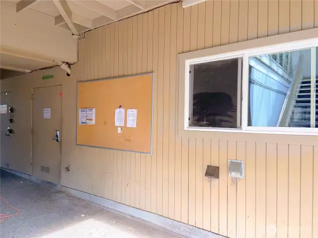 Down on the west end of the parking area is the laundry room behind the window, and the secure storage is behind the laundry room.
