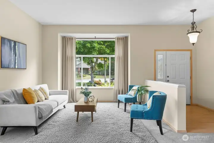 A warm and welcoming entryway leads to spacious living areas designed for comfort and connection.(Virtually Staged)