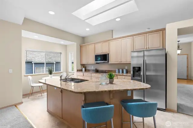 The heart of the home! This chef's kitchen is equipped with modern appliances, ample counter space, and a center island, ideal for cooking and entertaining.
