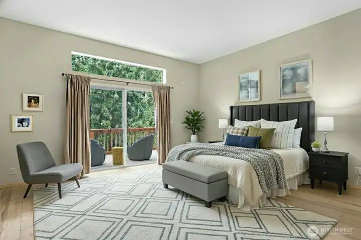 Spacious primary suite retreat featuring a spa-like ensuite bath and peaceful forest views. (Virtually Staged)