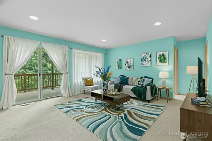 Open lower-level living area with full kitchen and easy access to the back deck—perfect for entertaining or guest quarters. (Virtually Staged)