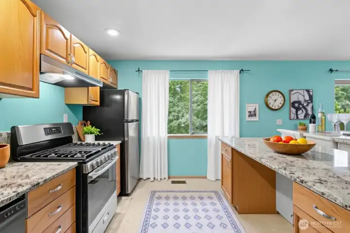 Spacious downstairs retreat offering privacy and comfort with full kitchen access. (Virtually Staged )