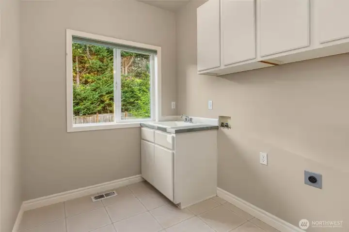 Utility room adjacent to the garage on the main level.